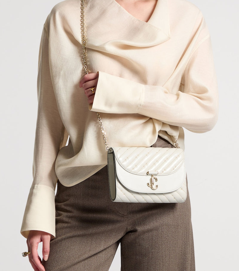 Jimmy Choo Curve leather clutch bag, imported from the UK
