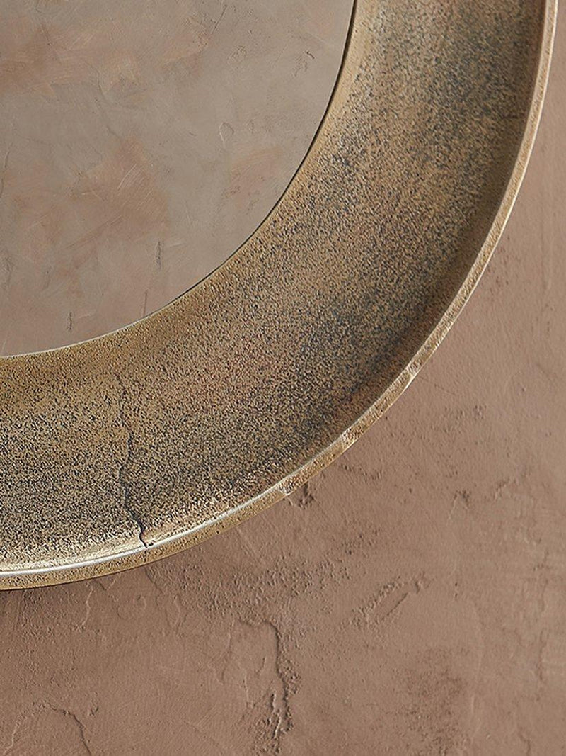 nkuku Yakira round wall mirror antique brass, UK version