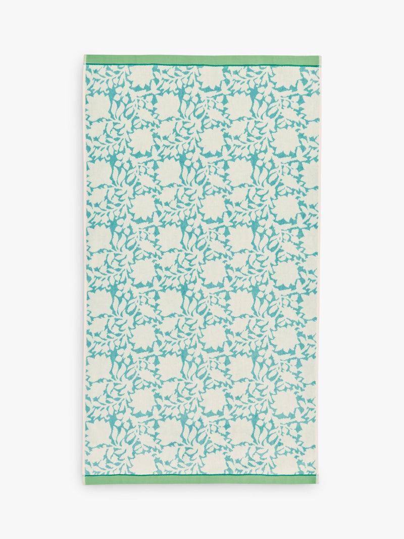 Land Shore floral blue bath towel with red and green trim, UK version