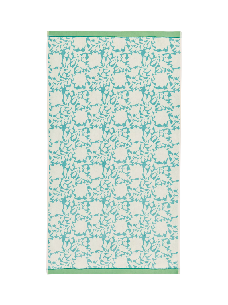 Land Shore floral blue bath towel with red and green trim, UK version