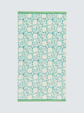 Land Shore floral blue bath towel with red and green trim, UK version