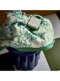 Land Shore floral blue bath towel with red and green trim, UK version