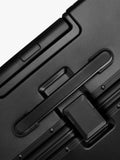 Carl Friedrik black 105L suitcase 79cm (British brand)