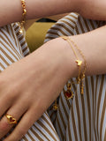 Ottoman Hands triple heart gold bracelet (British brand)
