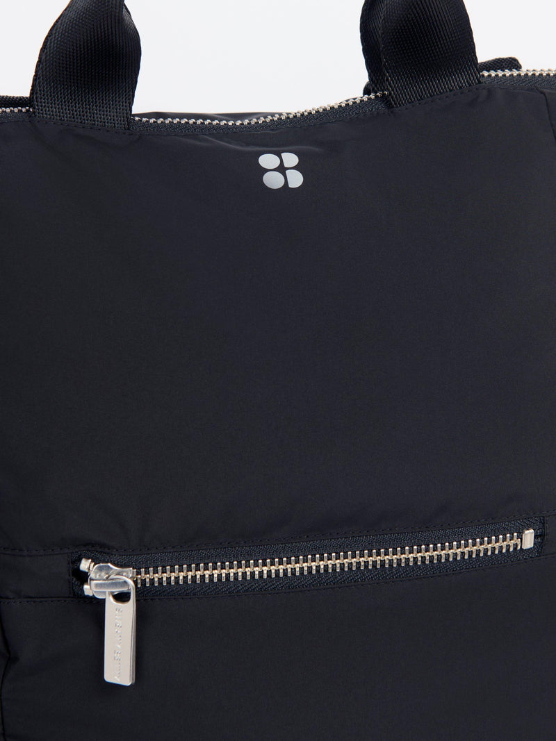 Sweaty Betty Nimbus backpack in black with reflective details, UK version