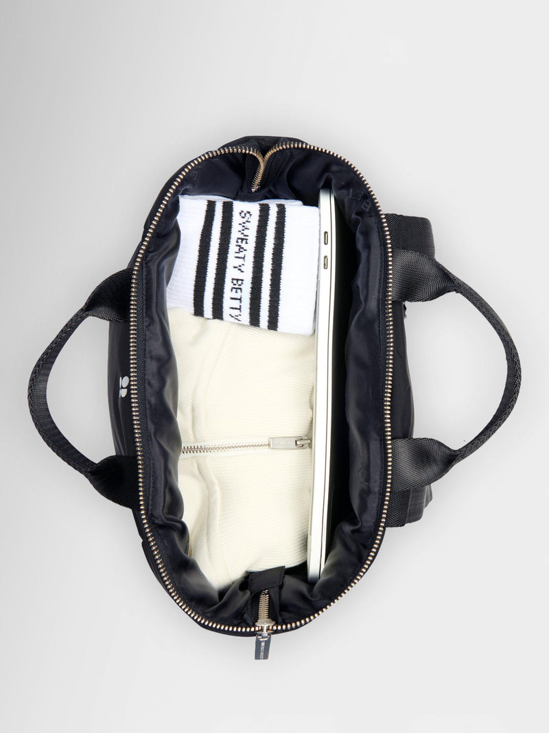 Sweaty Betty Nimbus backpack in black with reflective details, UK version