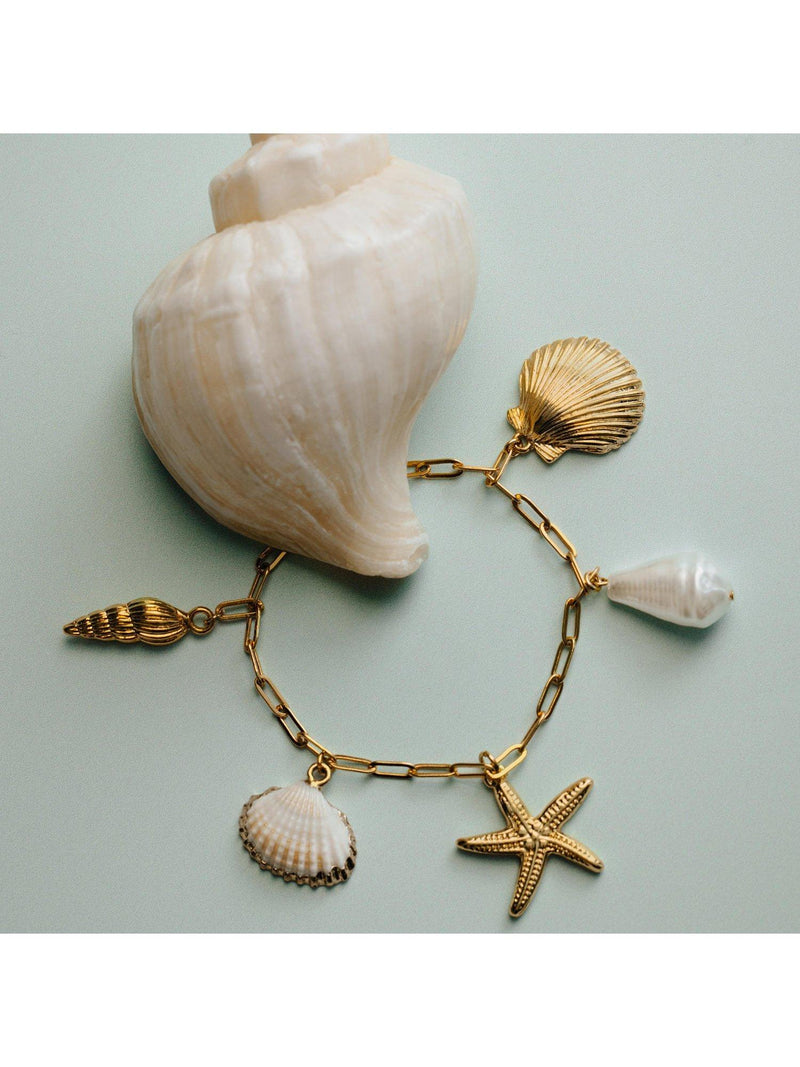 Orelia gold charm bracelet with shell and starfish, 16cm (British brand)