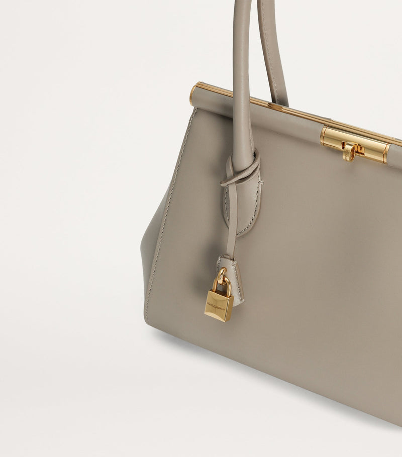 Dolce&Gabbana leather top-handle bag with gold-tone hardware, imported from the UK