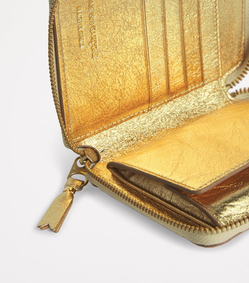 Comme Des Garçons gold embossed leather wallet, imported from the UK