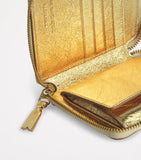 Comme Des Garçons gold embossed leather wallet, imported from the UK