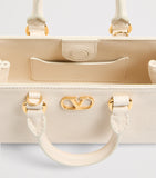 Valentino Garavani VLogo Mini top-handle bag in grained leather (British brand)