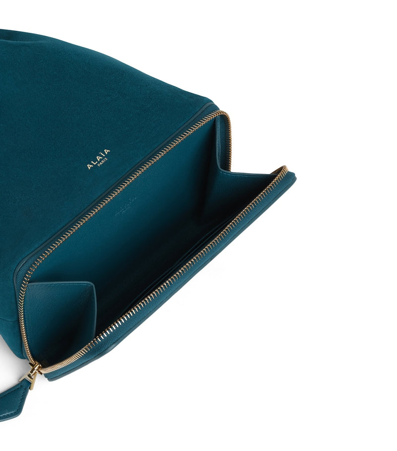 Alaïa Le Ponchon suede cross-body bag, imported from the UK