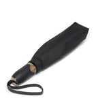 Tumi medium umbrella with red accents and reflective trim (British brand)