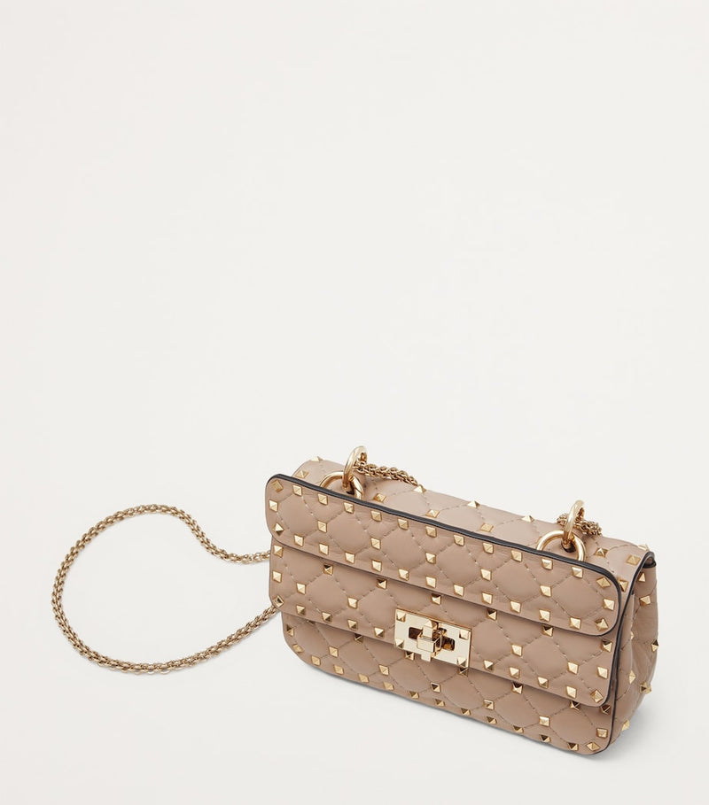 Valentino Garavani Small Rockstud Spike top-handle bag quilted lambskin (British brand)