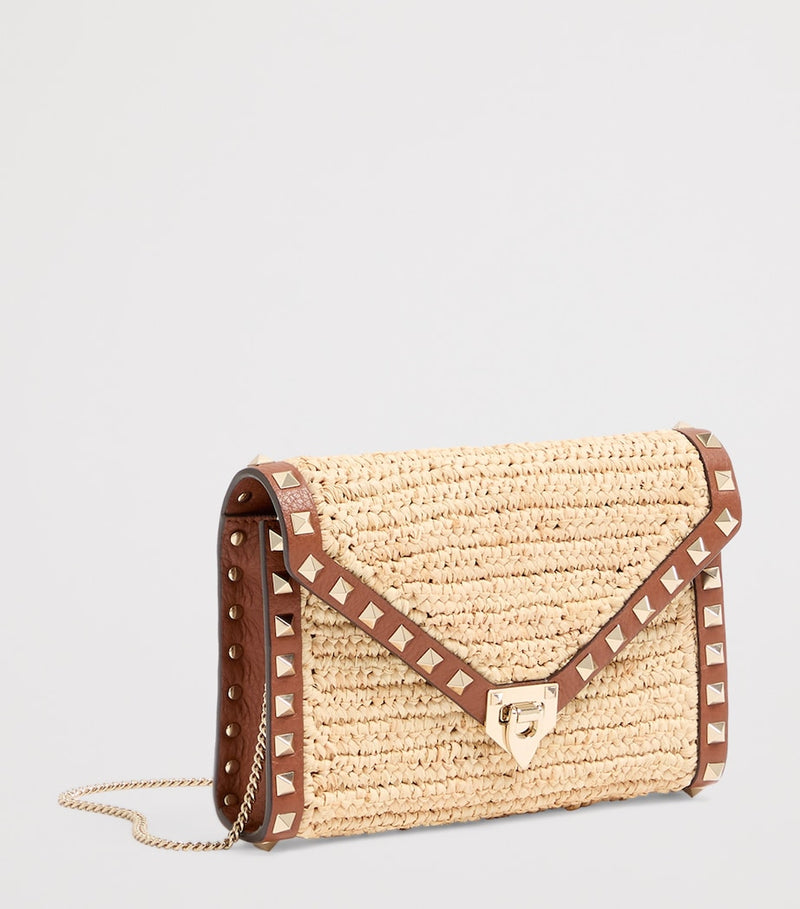 Valentino Garavani mini straw Rockstud cross-body bag - British product