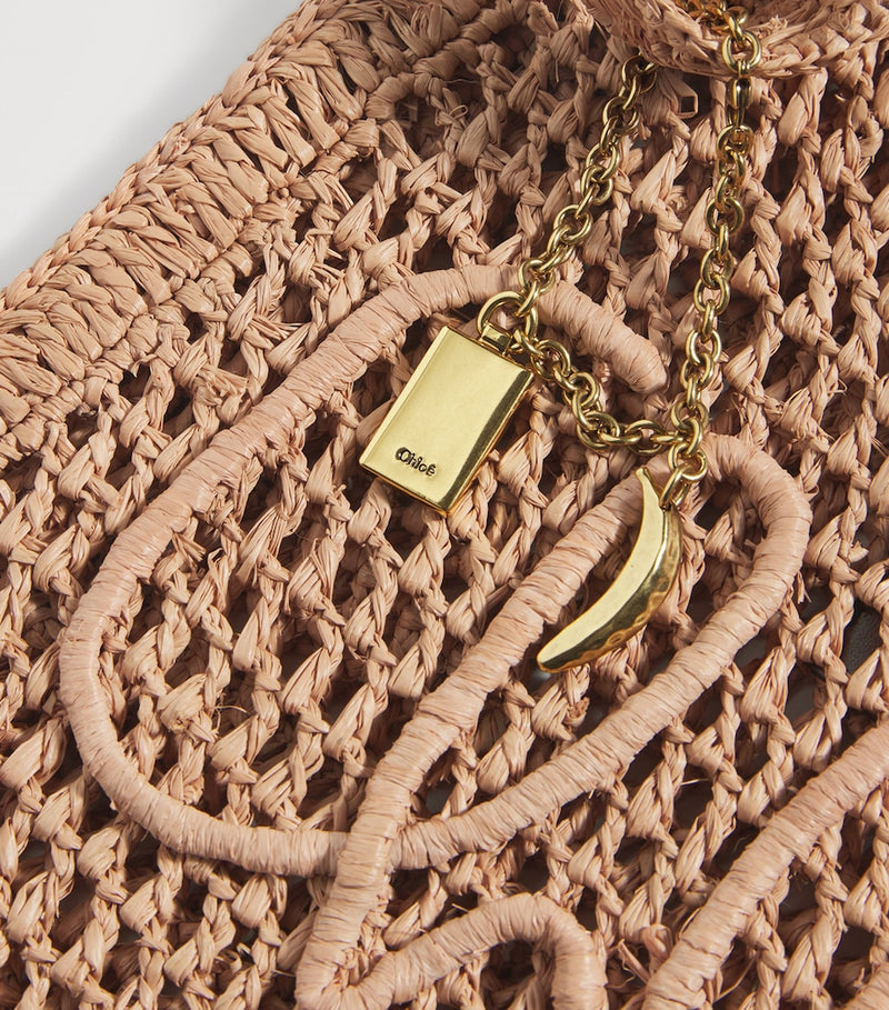 Chloé handwoven banana tote bag with gold charm, imported from the UK