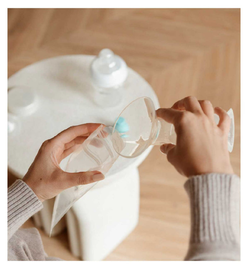 Nuby silicone breast pump with 180ml bottle and accessories, imported from the UK