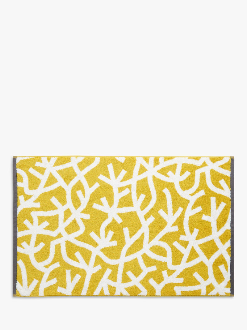 Mini Moderns cotton bath mat with forest graphic print in mustard, imported from the UK