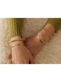 LARNAUTI gold plated rope cuff bangle (British brand)