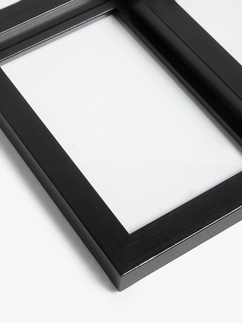 John Lewis 9-photo frame in black, imported from the UK