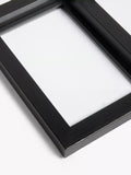 John Lewis 9-photo frame in black, imported from the UK