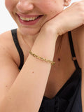 Coach gold chain bracelet with C-link design, UK version