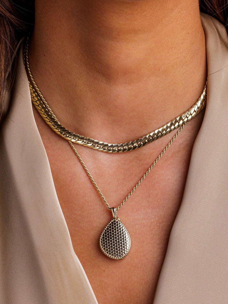LARNAUTI gold pebble locket necklace, imported from the UK