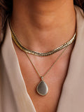 LARNAUTI gold pebble locket necklace, imported from the UK