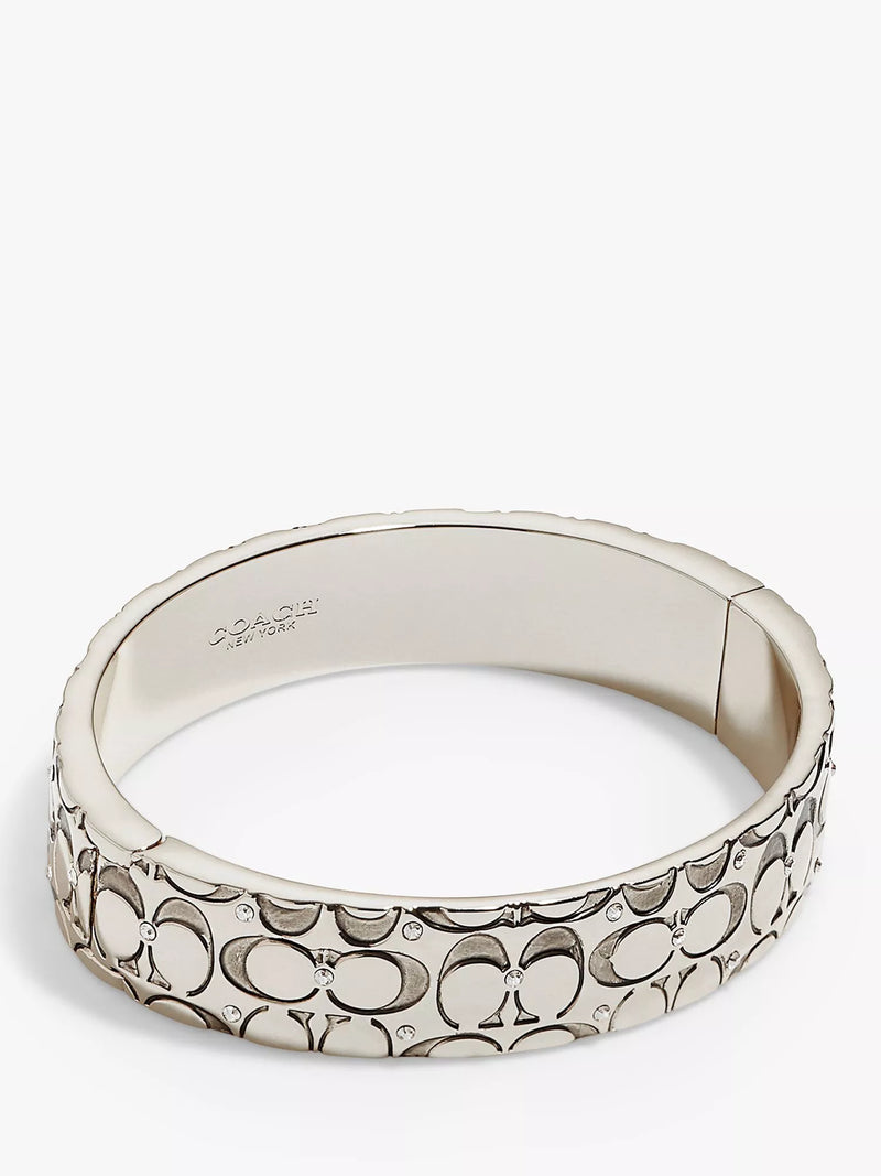 Coach silver crystal bangle with hinged closure, imported from the UK