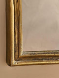 Nkuku Almora arched overmantel mirror antique brass finish - British product