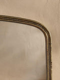 Nkuku Almora arched overmantel mirror antique brass finish - British product