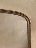Nkuku Almora arched overmantel mirror antique brass finish - British product