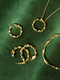 Orelia ribbon twist bangle gold plated (British brand)
