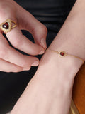 Rachel Jackson London gold plated heart bracelet with garnet (British brand)