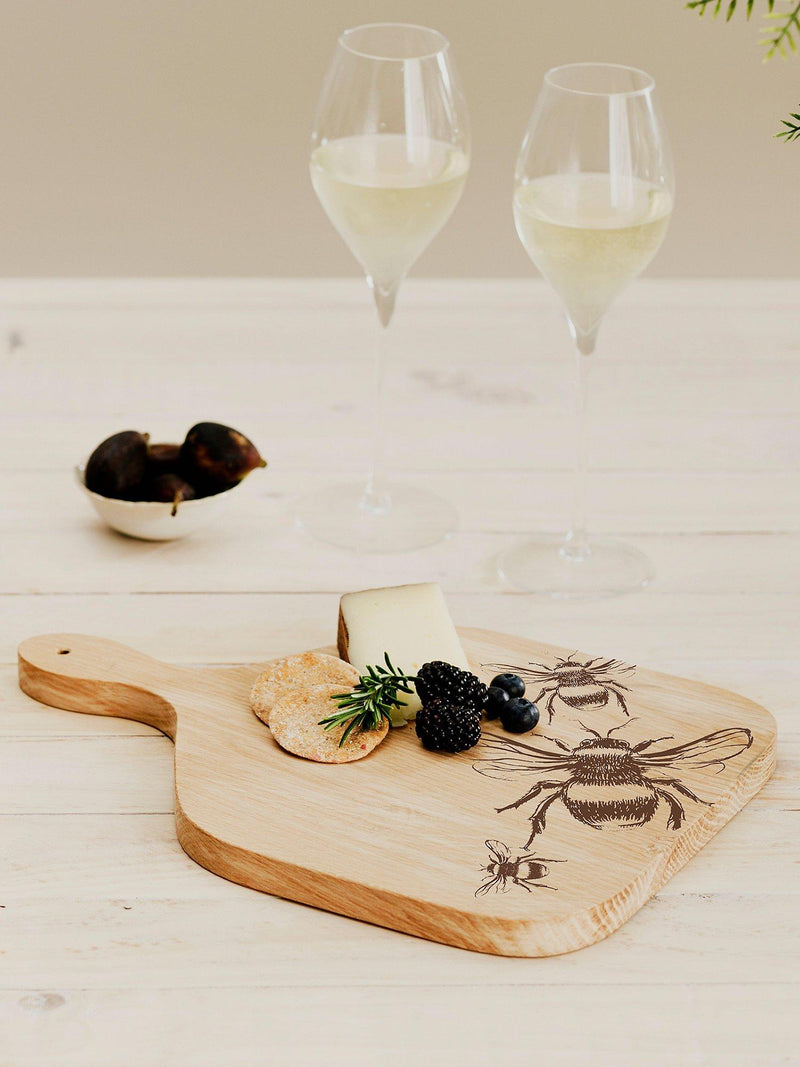 Selbrae House oak paddle board with bee engraving, imported from the UK