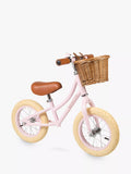 Banwood balance bike with wicker basket and bell, imported from the UK