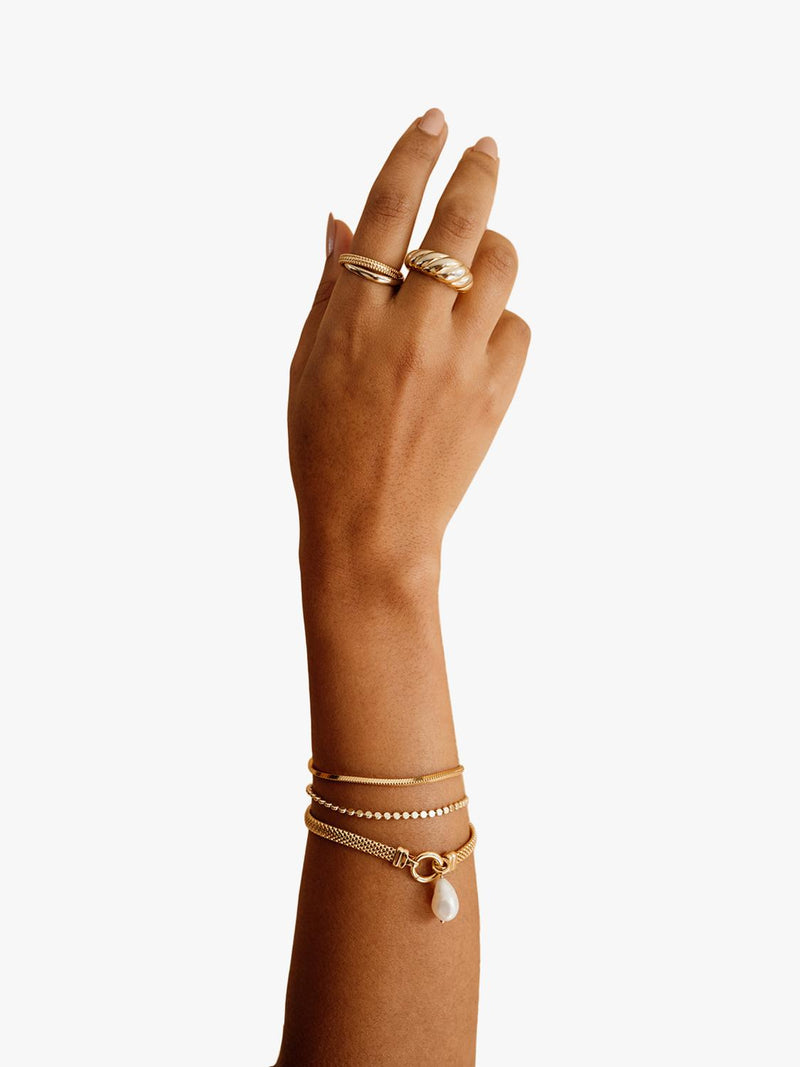 LARNAUTI freshwater pearl drop mesh bracelet in gold, imported from the UK