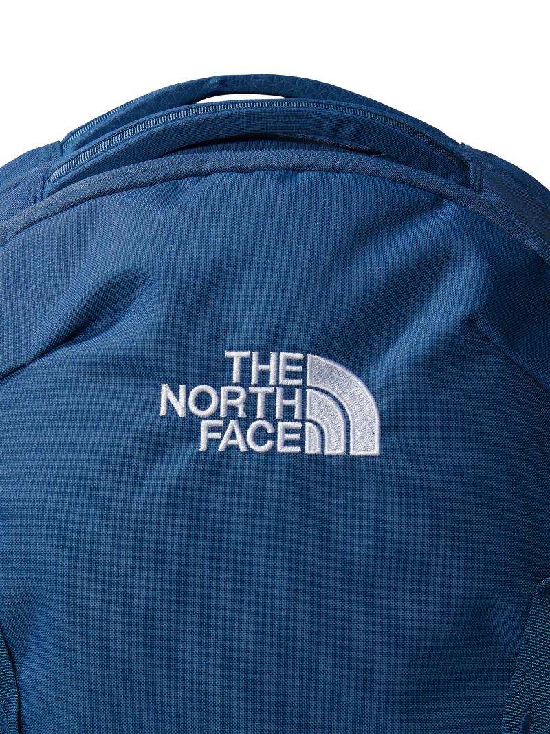 The North Face Vault backpack in blue and white, imported from the UK