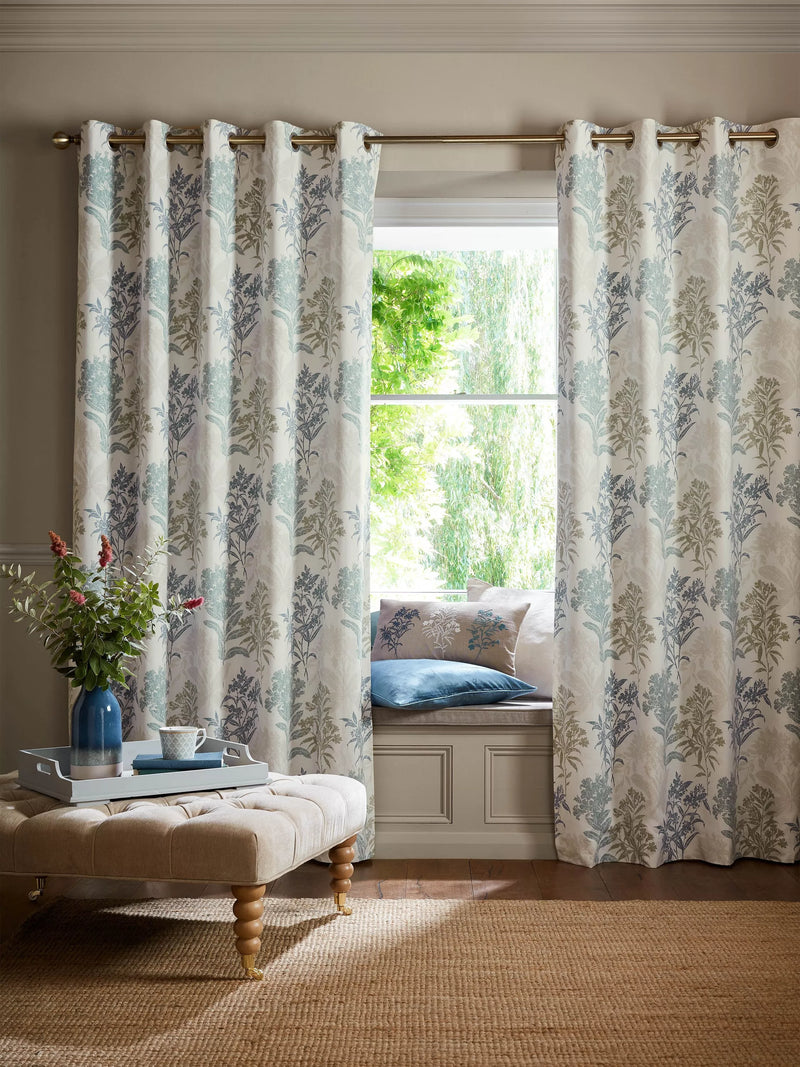 Laura Ashley lined eyelet curtains with floral design in seaspray, UK version