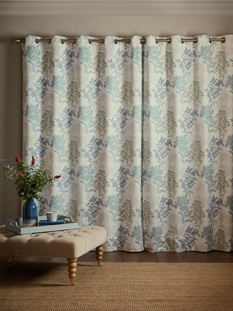 Laura Ashley lined eyelet curtains with floral design in seaspray, UK version