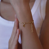 ENAMEL Copenhagen organic clover charm gold 8.5mm (British brand)