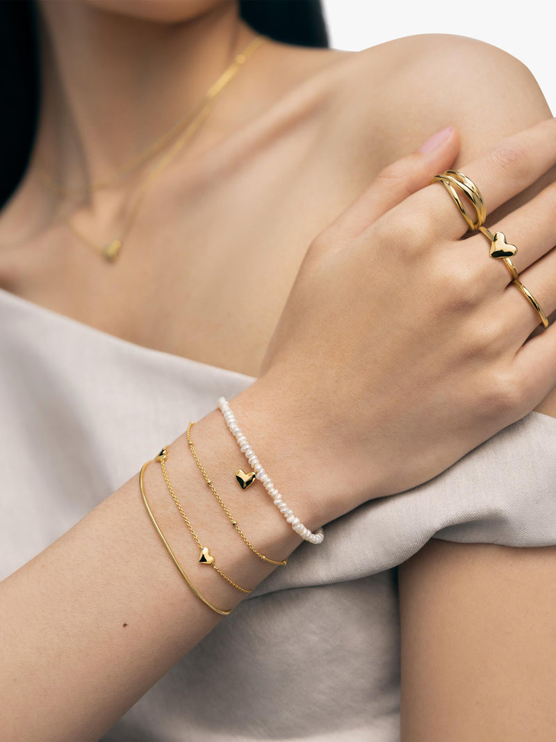 Monica Vinader Mini Heart Pearl Bracelet Gold, imported from the UK