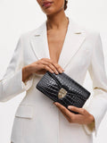 Aspinal of London patent croc clutch bag in black, imported from the UK