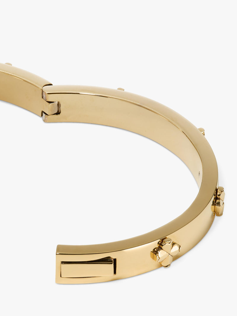 kate spade new york hinged flower bangle gold plated, imported from the UK