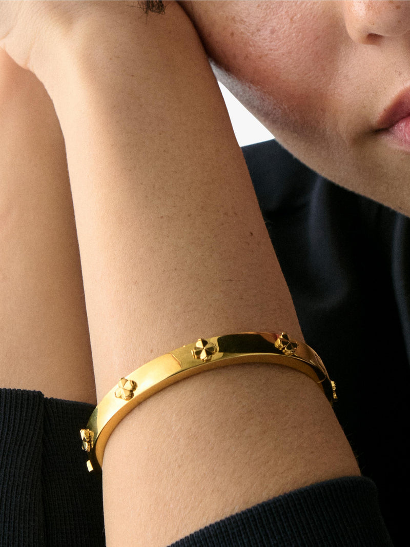 kate spade new york hinged flower bangle gold plated, imported from the UK