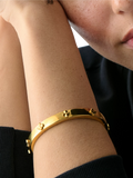 kate spade new york hinged flower bangle gold plated, imported from the UK