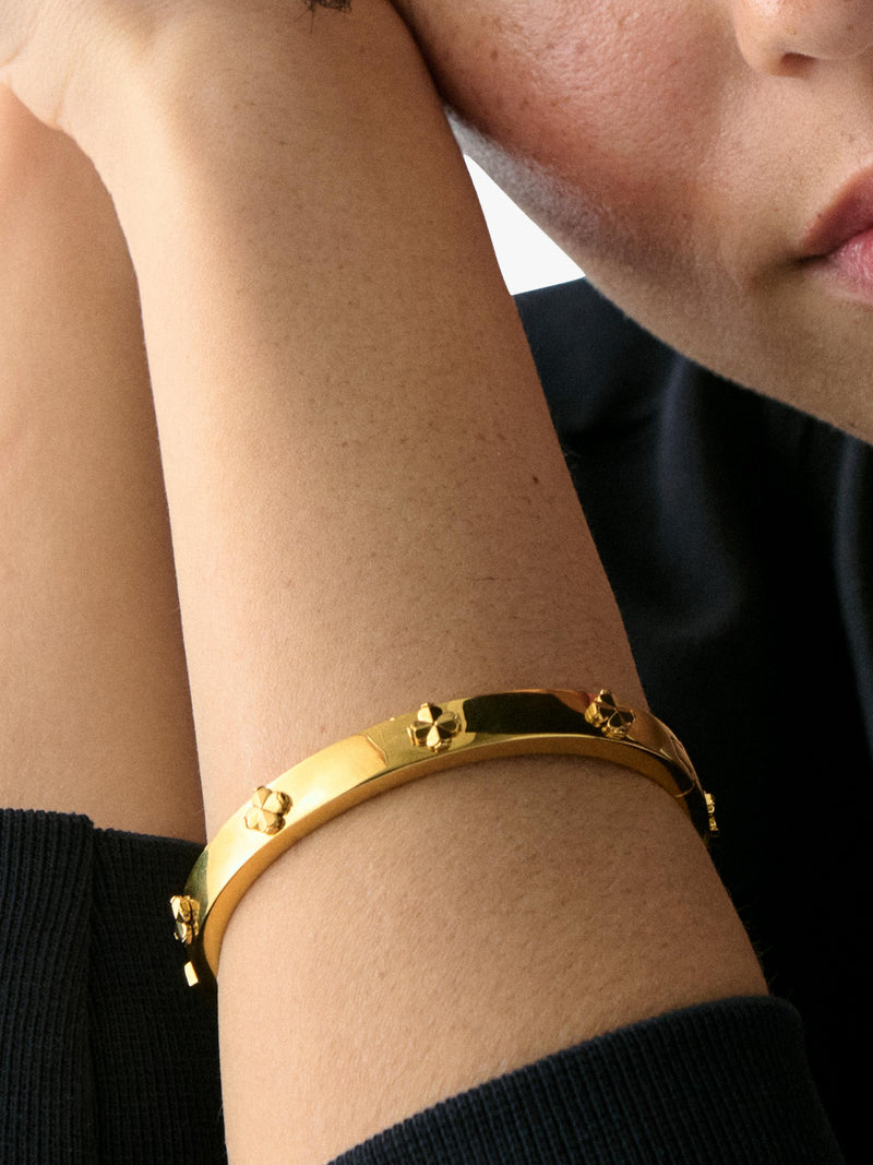 kate spade new york hinged flower bangle gold plated, imported from the UK