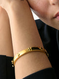 kate spade new york hinged flower bangle gold plated, imported from the UK