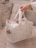 Avery Row baby changing caddy in Anemone floral print - British product