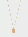 Tutti textured pendant necklace in gold, UK version